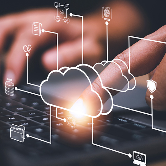 hands on keyboard with cloud diagram overlay