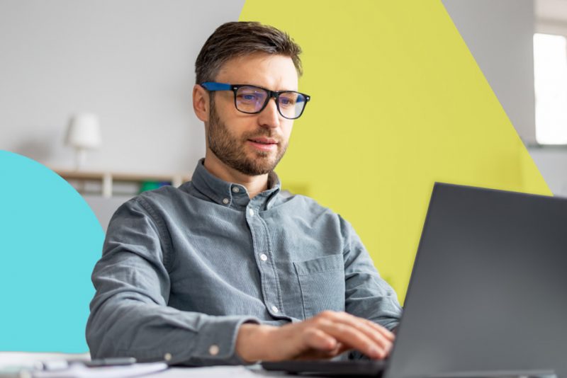 man on laptop reviewing security threats